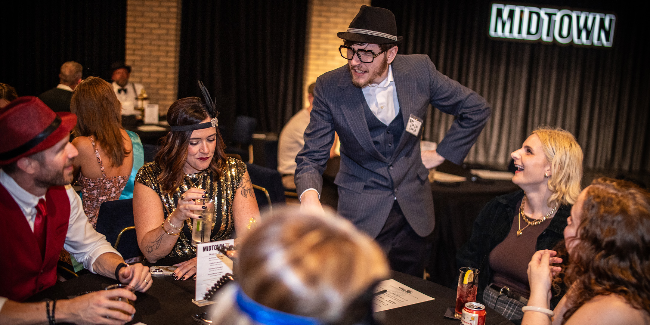 Guests at a Murder Mystery Company public dinner show in Minneapolis